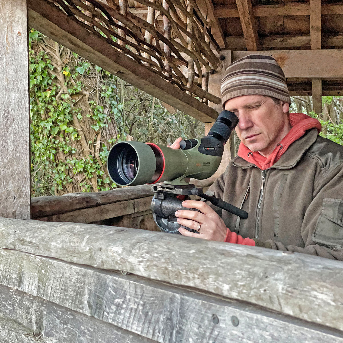 Kowa TSN-88A PROMINAR 25-60x Angled Spotting Scope Kit in use, showcasing its precision and ergonomic design outdoors.